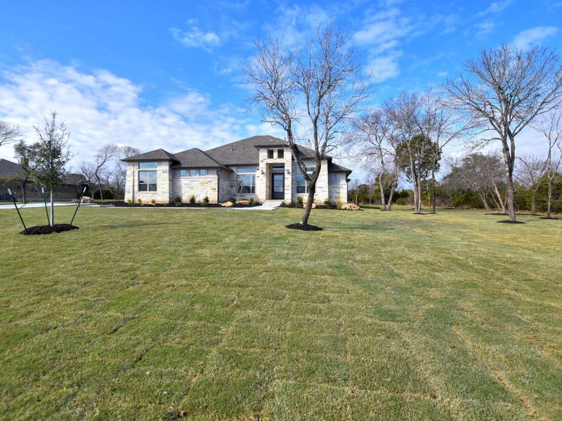 Representative exterior photo of a completed home built from the San Simeon I by Giddens Homes in Clearwater Ranch, Liberty Hill, TX (Image 48).