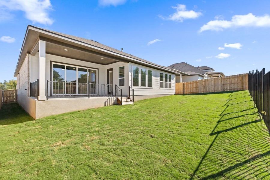 Exterior details and patio area of a home in Lariat, Liberty Hill (Image 25).