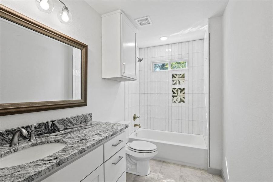 Bathroom featuring shower / bathtub combination and vanity