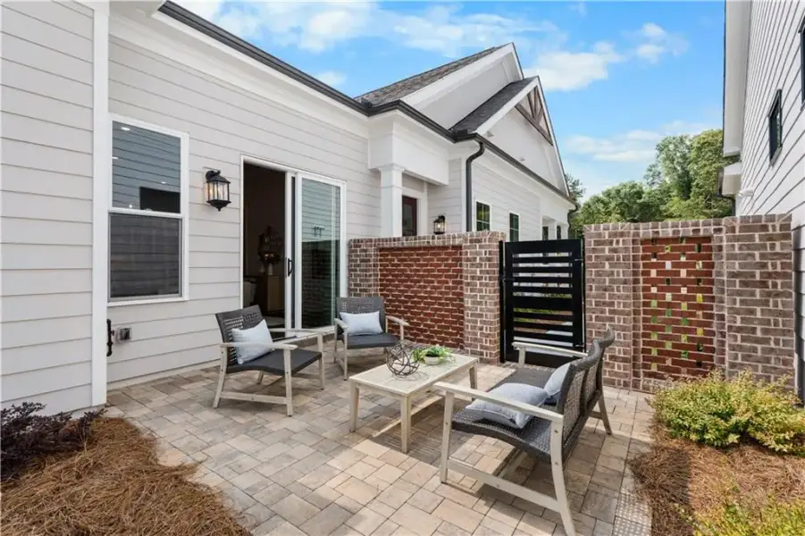 Exterior details and patio area of a home in The Villas at Aberdeen, Hoschton (Image 4).