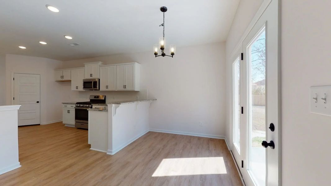 Representative furnished interior of a home built from the Catherine A by JC Jackson Homes,LLC in Heritage Pointe, Newport (Image 12).