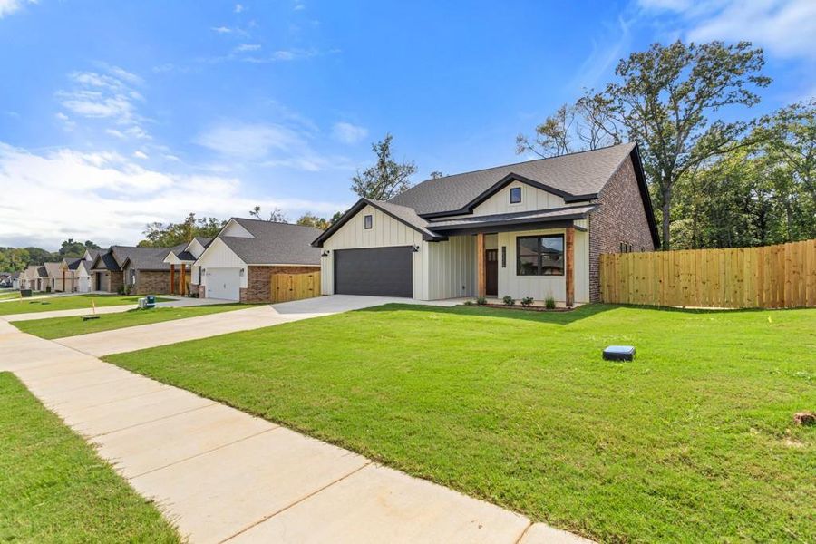 Front exterior of a new home in , Lindale, TX, highlighting curb appeal (Image 19). Front exterior of a new home in , Lindale, TX, highlighting curb appeal (Image 19).