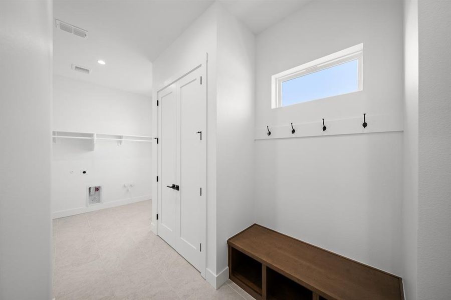 Mudroom featuring recessed lighting and baseboards