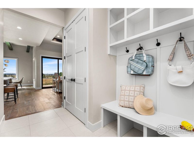 Mud room with cubbies and oversized double door closet