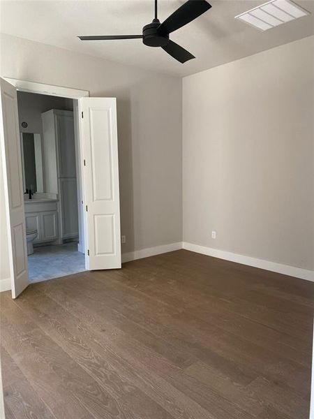 Unfurnished room featuring hardwood / wood-style flooring and ceiling fan