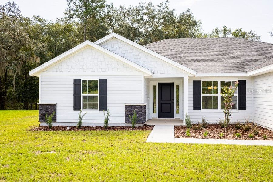Front exterior of a new home in The Preserve at Laurel Lake, Lake City, FL, highlighting curb appeal (Image 22). Front exterior of a new home in The Preserve at Laurel Lake, Lake City, FL, highlighting curb appeal (Image 22).