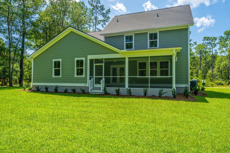 Front exterior of a new home in , Awendaw, SC, highlighting curb appeal (Image 1). Front exterior of a new home in , Awendaw, SC, highlighting curb appeal (Image 1).