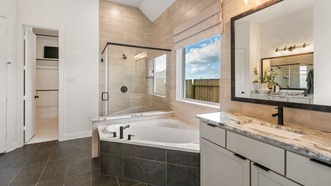 Representative furnished interior of a home built from the Rosewood by Brightland Homes in Sunterra, Katy (Image 15).