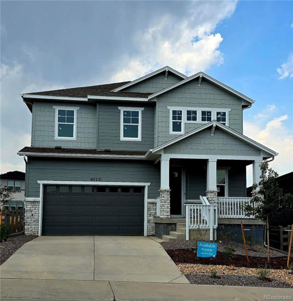 Front exterior of a new home in Prelude at Sterling Ranch, Littleton, CO, highlighting curb appeal (Image 2).