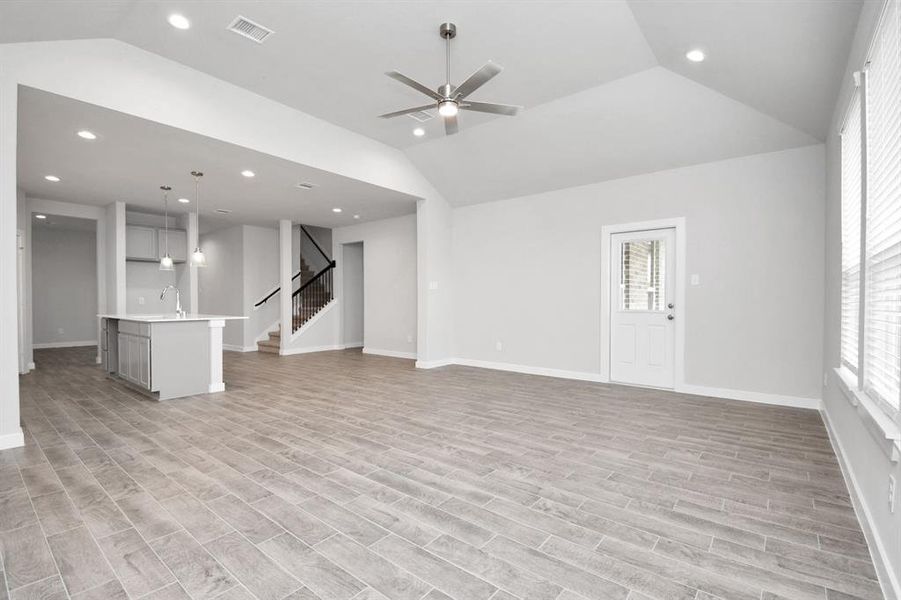 Another view of family room area. Sample photo of completed home with similar floor plan. Actual colors and selections may vary.