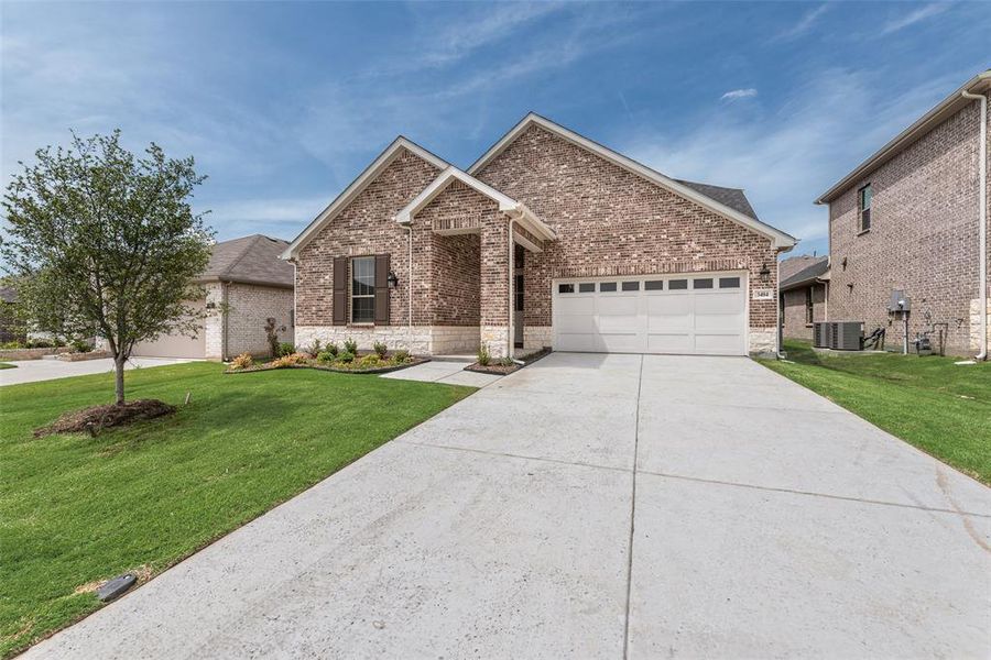 Front exterior of a new home in Villages of Hurricane Creek, Anna, TX, highlighting curb appeal (Image 17). Front exterior of a new home in Villages of Hurricane Creek, Anna, TX, highlighting curb appeal (Image 17).