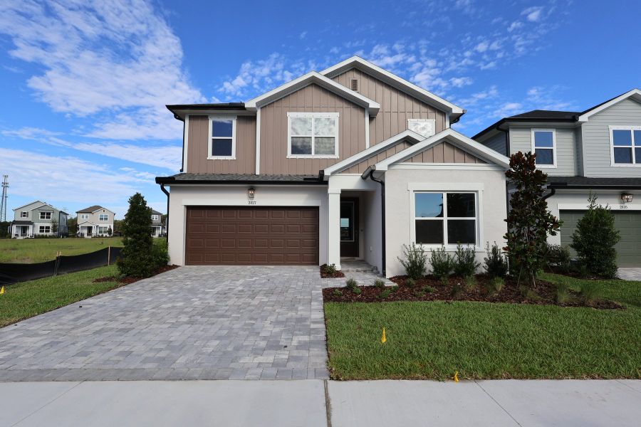 Front exterior of a new home in Soleta at Starkey Ranch – Traditional Series, Odessa, FL, highlighting curb appeal (Image 1). Front exterior of a new home in Soleta at Starkey Ranch – Traditional Series, Odessa, FL, highlighting curb appeal (Image 1).