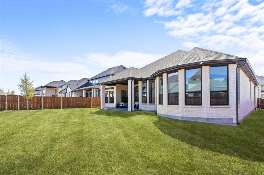 Exterior details and patio area of a home in Mustang Lakes, Celina (Image 4).