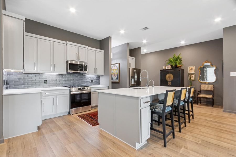 Enormous bar area with built in trash can and island seating