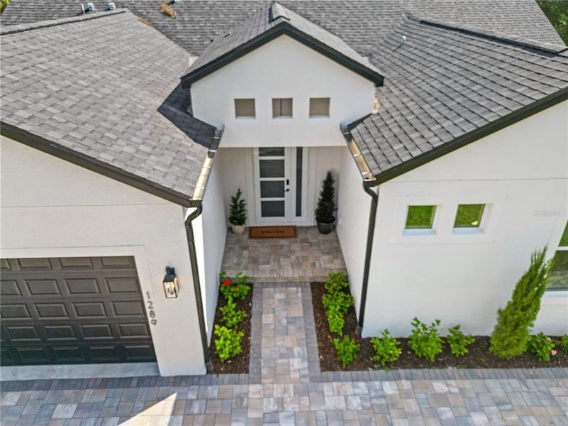Front exterior of a new home in , North Port, FL, highlighting curb appeal (Image 27). Front exterior of a new home in , North Port, FL, highlighting curb appeal (Image 27).
