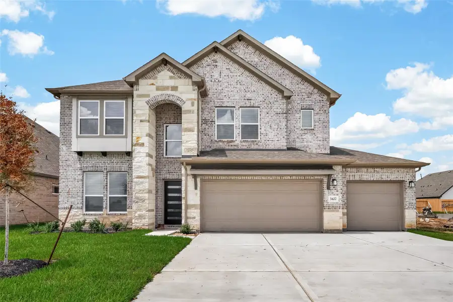 Front exterior of a new home in Foxtail Palms, Manvel, TX, highlighting curb appeal (Image 1). Front exterior of a new home in Foxtail Palms, Manvel, TX, highlighting curb appeal (Image 1).