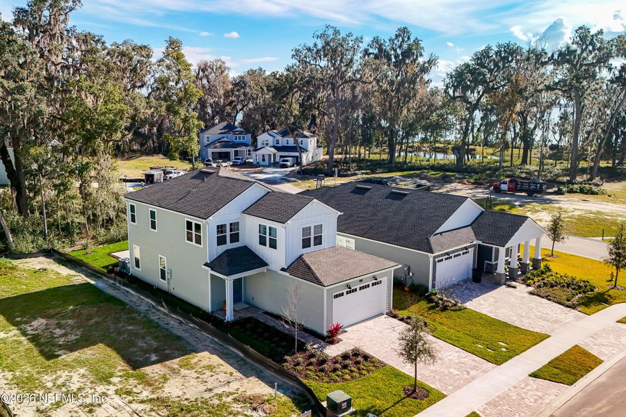 Front exterior of a new home in , St. Johns, FL, highlighting curb appeal (Image 26).