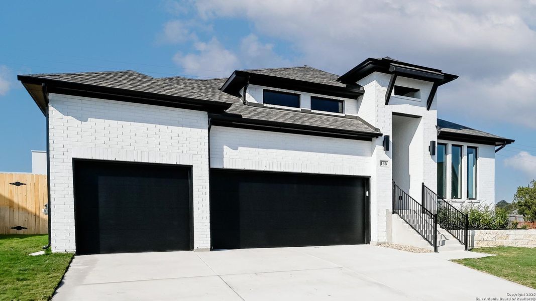 Front exterior of a new home in Cibolo Valley Heights 65', Cibolo, TX, highlighting curb appeal (Image 2).