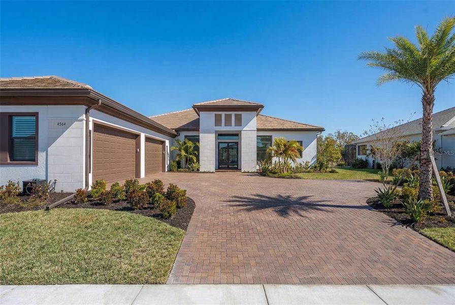 Front exterior of a new home in , Sarasota, FL, highlighting curb appeal (Image 29).