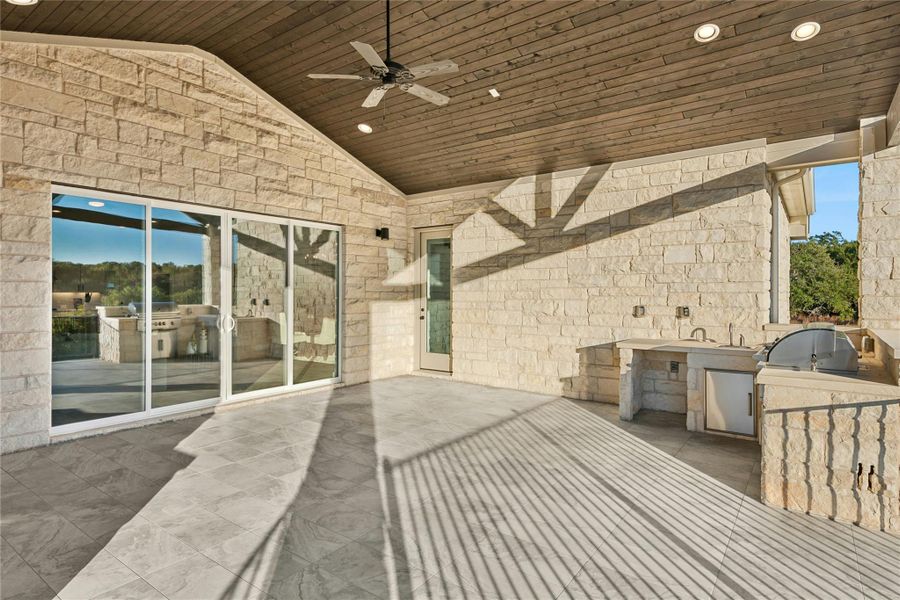 View of patio / terrace with an outdoor kitchen and a ceiling fan View of patio / terrace with an outdoor kitchen and a ceiling fan