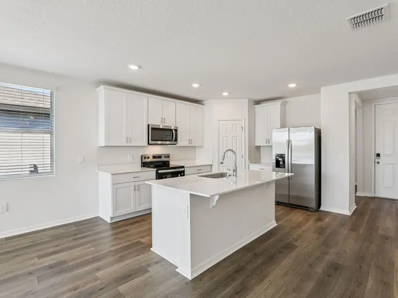 Furnished interior view inside a new home in Villamar - Signature Series, Winter Haven (Image 3).