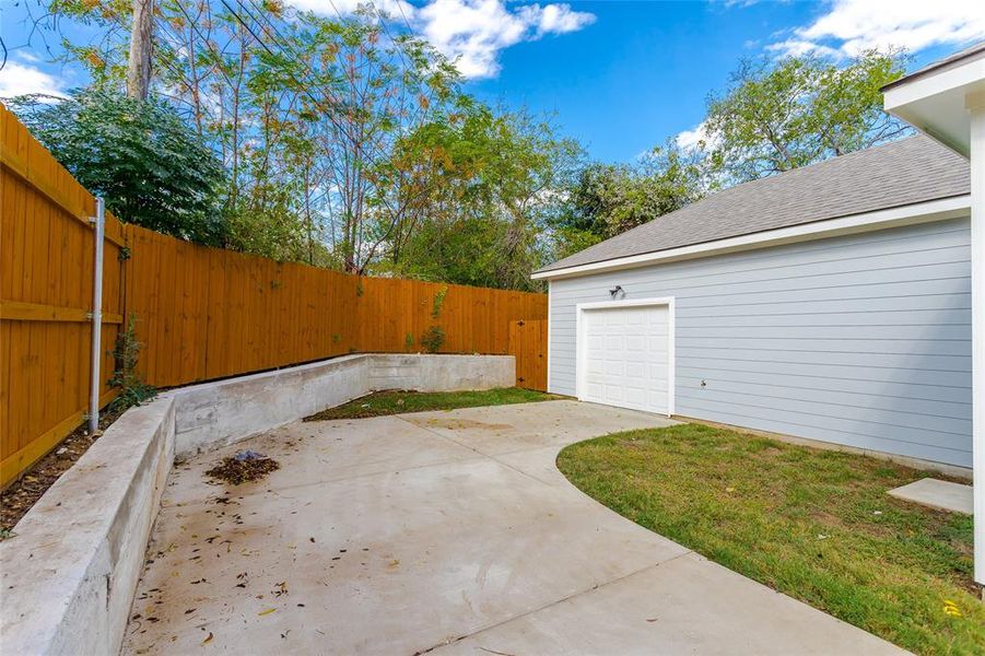 View of patio / terrace featuring a garage