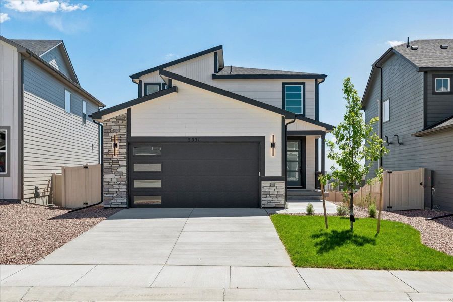 Front exterior of a new home in Trails at Aspen Ridge-3, Colorado Springs, CO, highlighting curb appeal (Image 19).