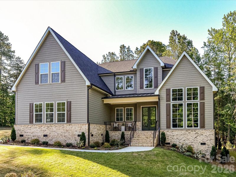 Stunning craftsman-style home with charming covered front porch, stone accents, and nestled on a private, wooded lot offering both curb appeal and peaceful surroundings. Stunning craftsman-style home with charming covered front porch, stone accents, and nestled on a private, wooded lot offering both curb appeal and peaceful surroundings.