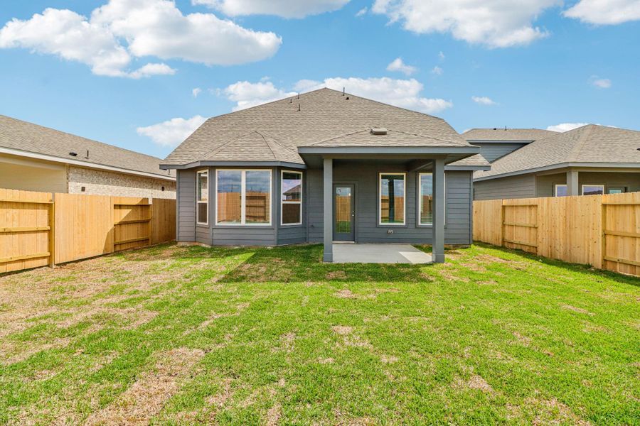 Exterior details and patio area of a home in Sanford Farms - Premier Series, Waller (Image 24).