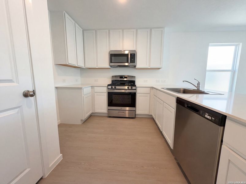 Furnished interior view inside a new home in Hunters Ranch, San Antonio (Image 7).