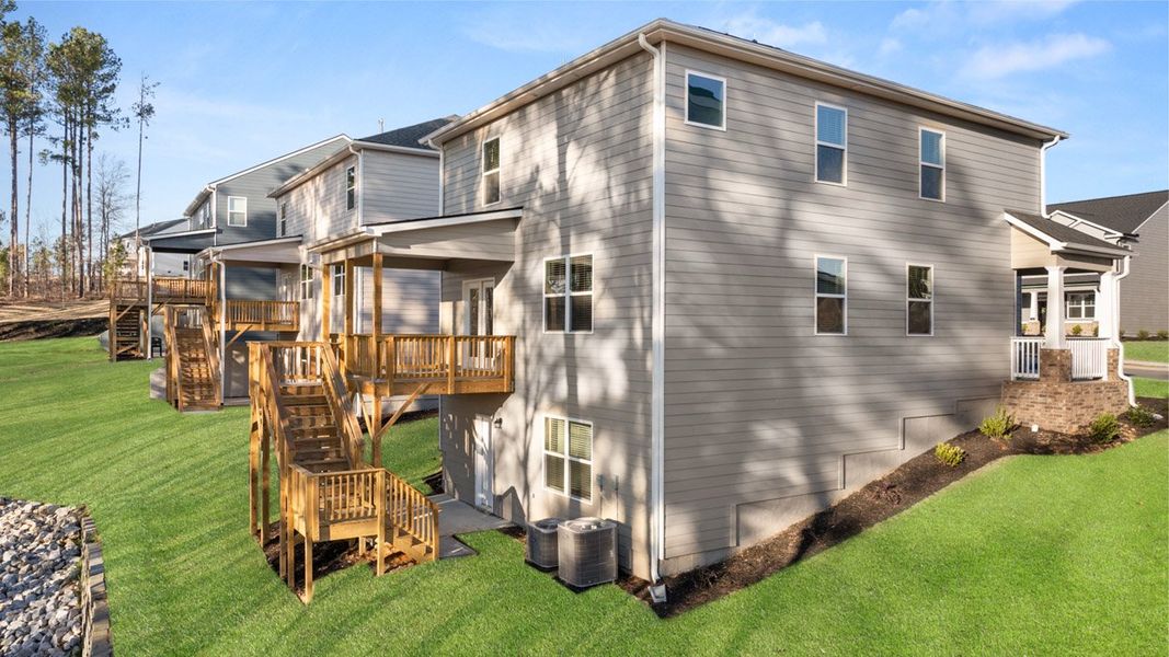 Front exterior of a new home in Southwind Village, Evans, GA, highlighting curb appeal (Image 25).