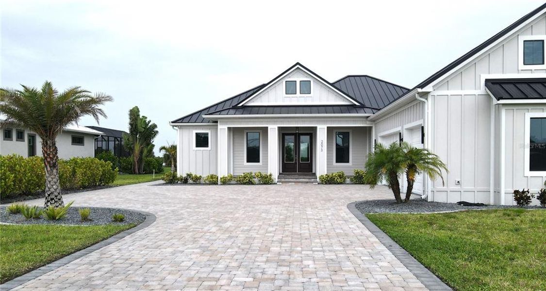 Front exterior of a new home in , Punta Gorda, FL, highlighting curb appeal (Image 24).