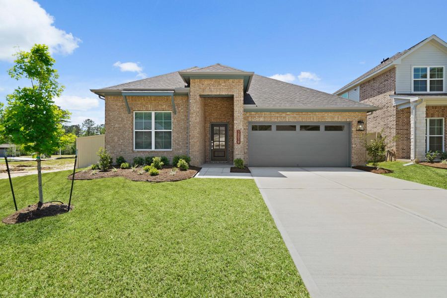 Front exterior of a new home in Audubon, Magnolia, TX, highlighting curb appeal (Image 15). Front exterior of a new home in Audubon, Magnolia, TX, highlighting curb appeal (Image 15).