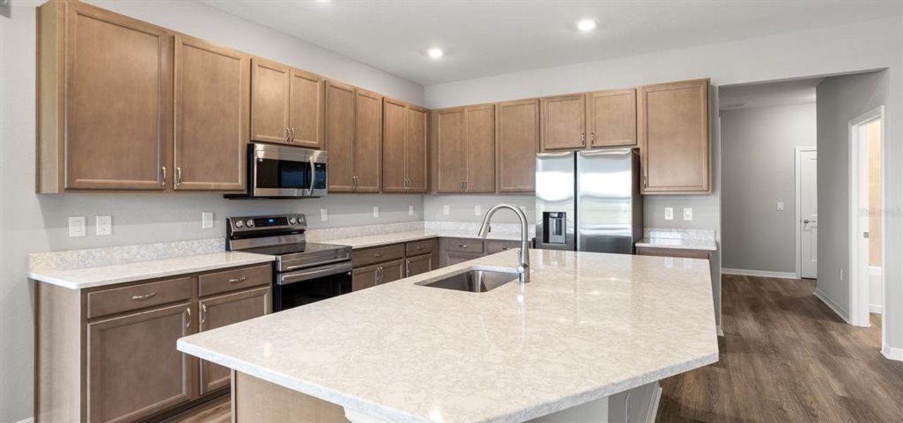 Furnished interior view inside a new home in Estates at Hickory Cove - Bungalows, St. Cloud (Image 7).