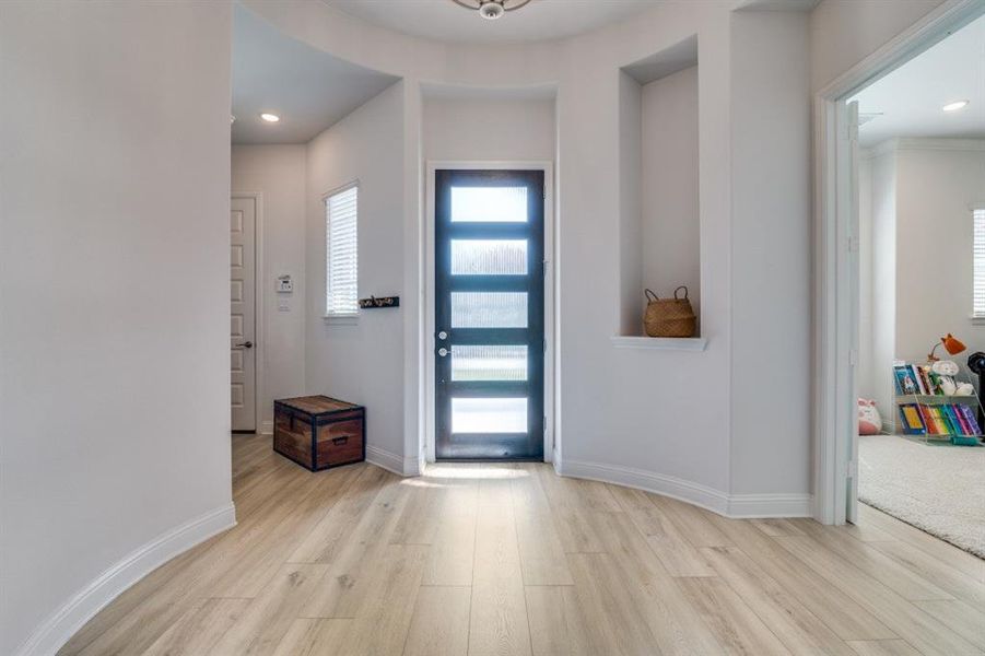 Entrance foyer with recessed lighting, wood finished floors, and baseboards Entrance foyer with recessed lighting, wood finished floors, and baseboards