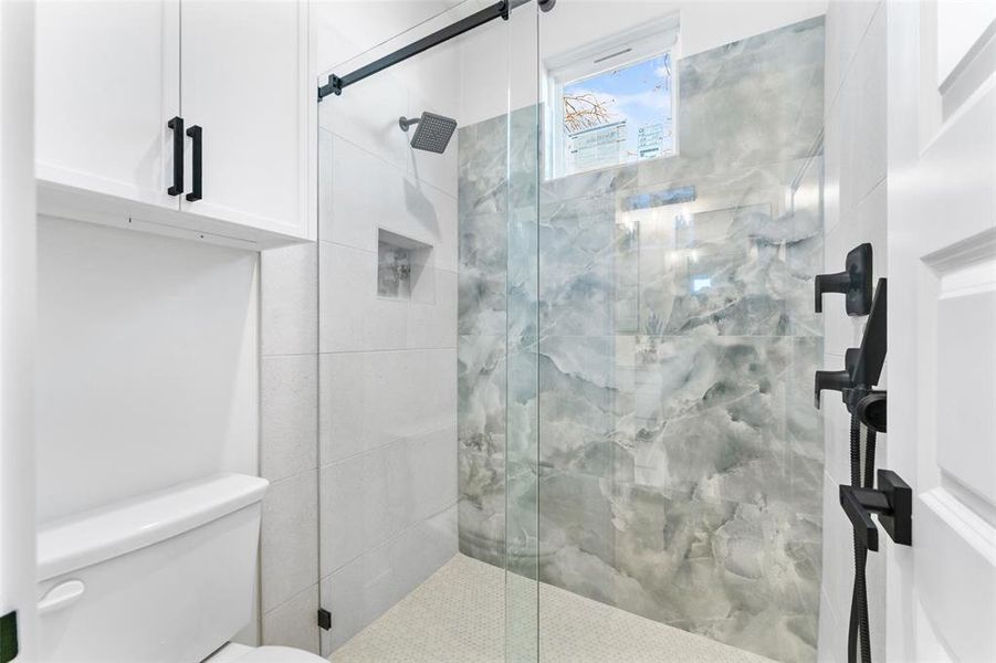 Bathroom featuring walk in shower