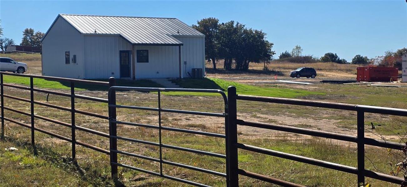 Lot is partially fenced with pipe fence and a private gate in back.