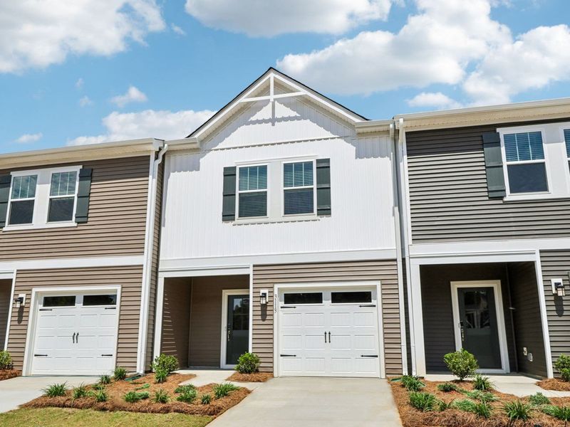 Front exterior of a new home in Rocky River Towns, Charlotte, NC, highlighting curb appeal (Image 1). Front exterior of a new home in Rocky River Towns, Charlotte, NC, highlighting curb appeal (Image 1).