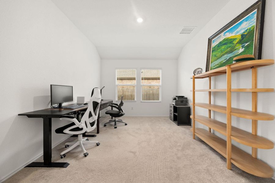 A quiet office space offers an ideal work-from-home setup with ample natural light.