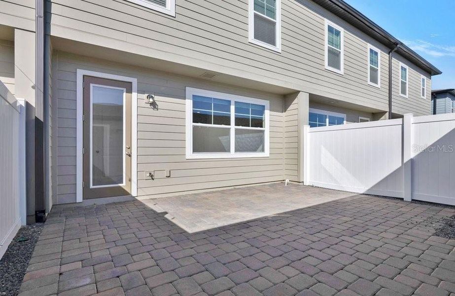 Exterior details and patio area of a home in Northlake at Ovation, Winter Garden (Image 24).
