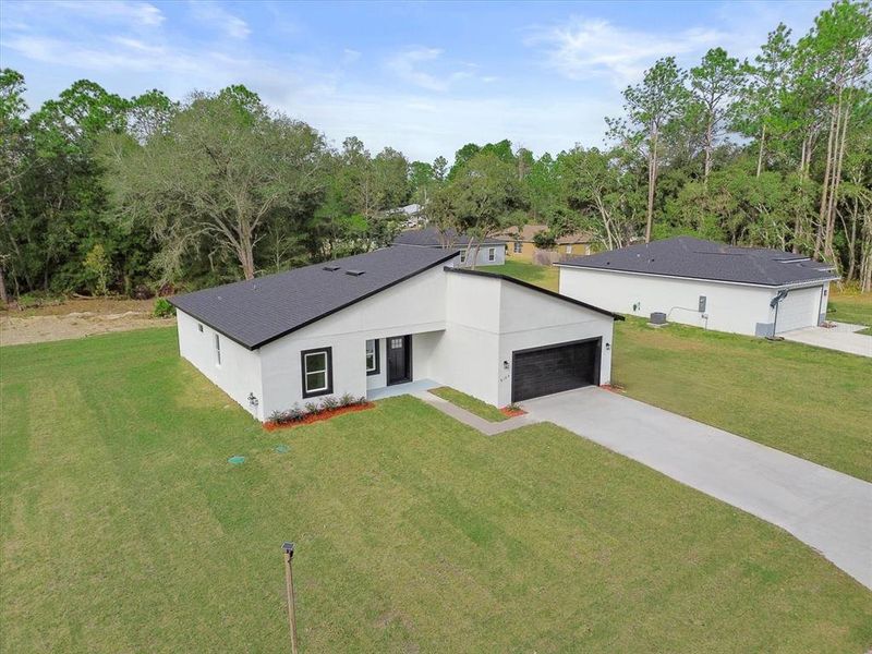 Front exterior of a new home in , Citrus Springs, FL, highlighting curb appeal (Image 20). Front exterior of a new home in , Citrus Springs, FL, highlighting curb appeal (Image 20).