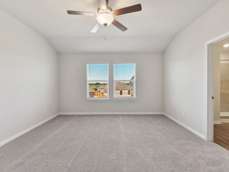 Enjoy the natural lighting in this primary bedroom.