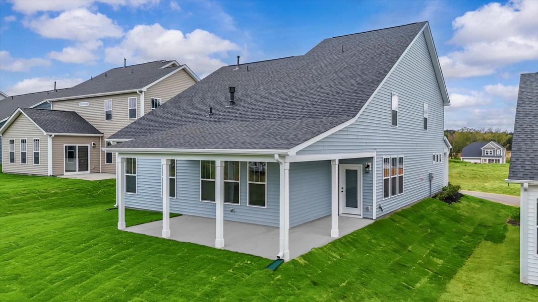 Rear covered porch creates a seamless extension of this home’s elegant design Rear covered porch creates a seamless extension of this home’s elegant design