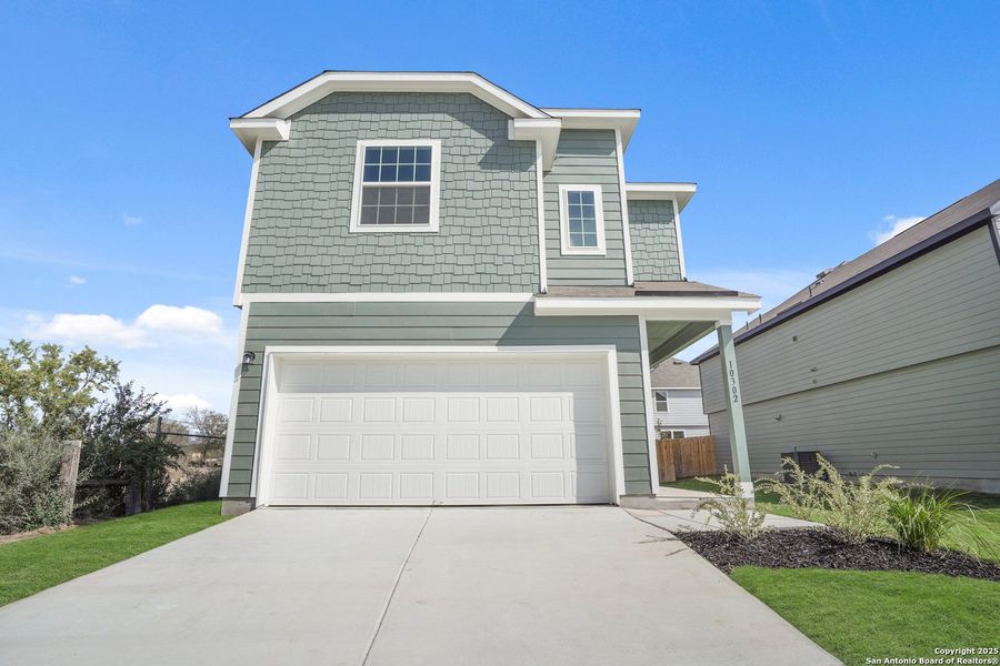 Front exterior of a new home in Applewhite Meadows, San Antonio, TX, highlighting curb appeal (Image 24).