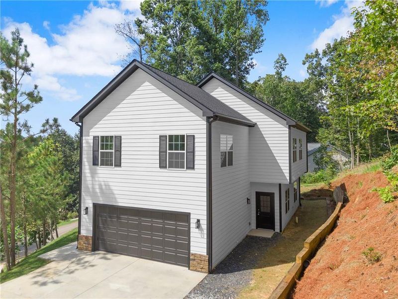 Front exterior of a new home in , Gainesville, GA, highlighting curb appeal (Image 16).