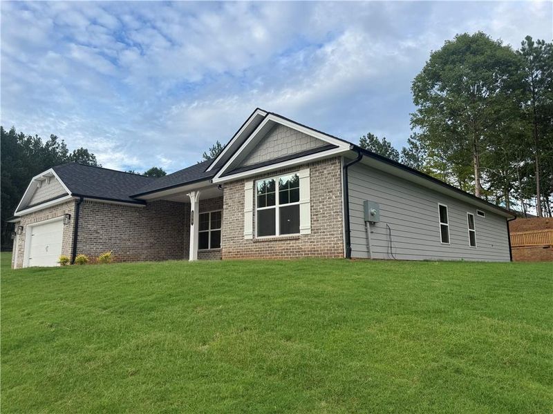 Exterior details and patio area of a home in The Fields of Walnut Creek, Pendergrass (Image 16).