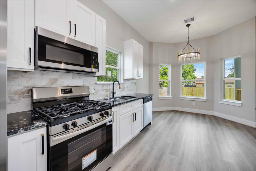 Gourmet kitchen is a chef’s dream,boasting a spacious island with quartz countertops, soft close cabinetry. Stainless steel appliances included. Gourmet kitchen is a chef’s dream,boasting a spacious island with quartz countertops, soft close cabinetry. Stainless steel appliances included.