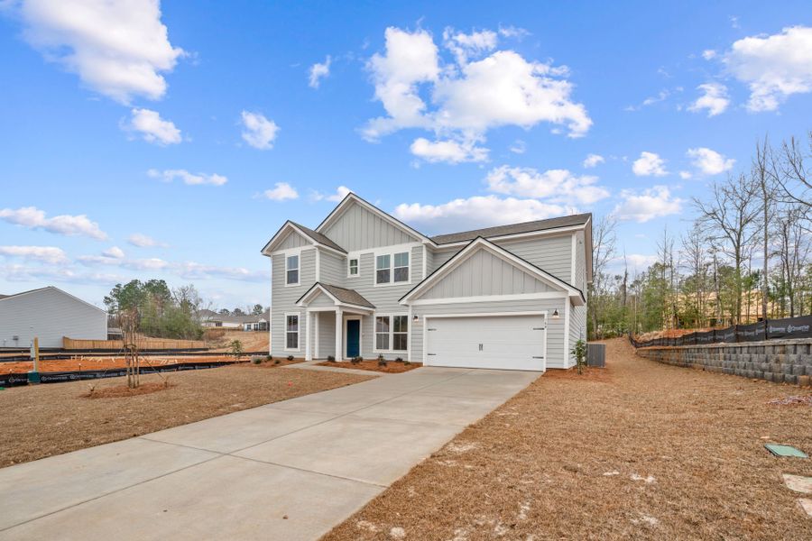 Front exterior of a new home in Carriage Estates, Lexington, SC, highlighting curb appeal (Image 2). Front exterior of a new home in Carriage Estates, Lexington, SC, highlighting curb appeal (Image 2).