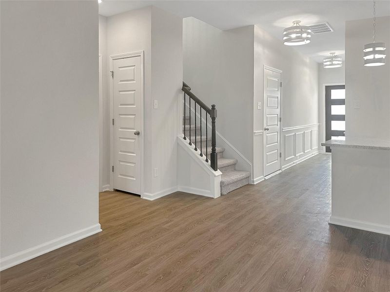 The Caldwell- Family Room and Foyer. Home is under construction. Sample image for illustration; upgrades, options, and colors may vary.