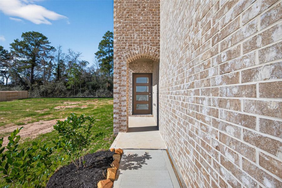 Exterior details and patio area of a home in Enclave at Willis, Willis (Image 3).